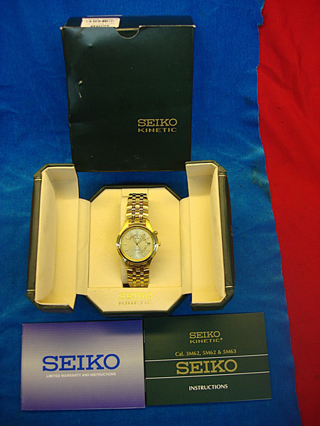 SEIKO SKH046 Men's Kinetic Wristwatch (NIB) - Visible Movement, Gold-Tone Finish - Verizon Award