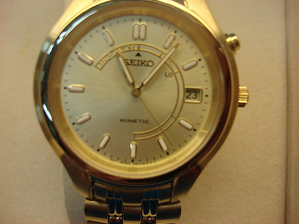 SEIKO SKH046 Men's Kinetic Wristwatch (NIB) - Visible Movement, Gold-Tone Finish - Verizon Award
