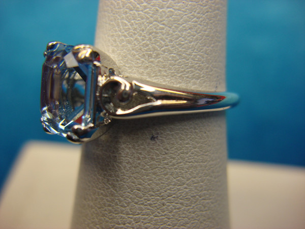 Avon Silver Tone Ring with Emerald Cut Blue Stone - Size 6.5