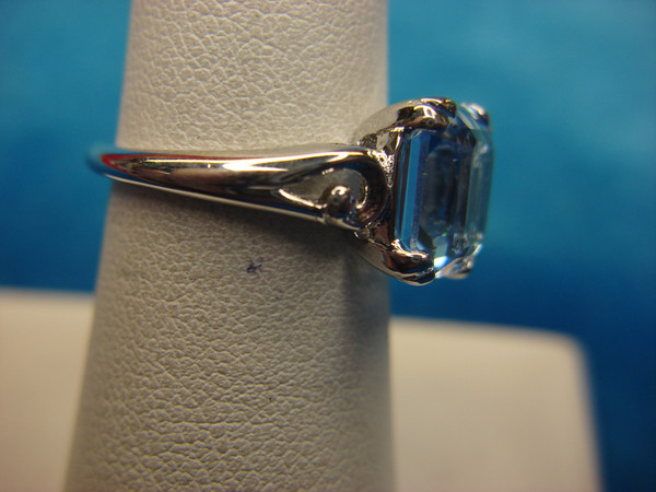 Avon Silver Tone Ring with Emerald Cut Blue Stone - Size 6.5