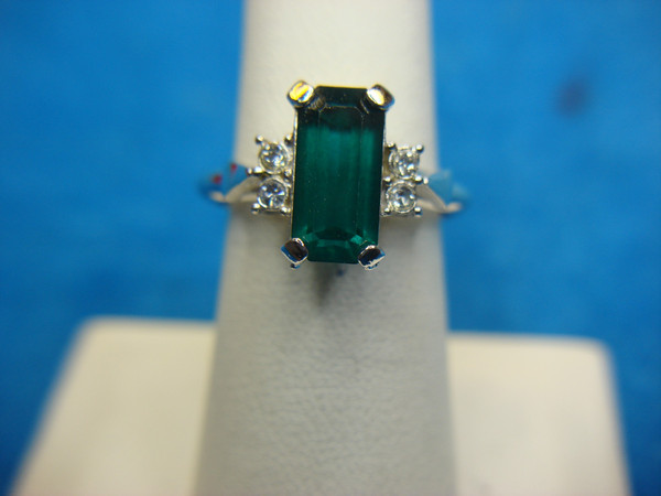 Avon Silver Tone Ring with Green Emerald Cut Stone - Adjustable Size 6.5-9