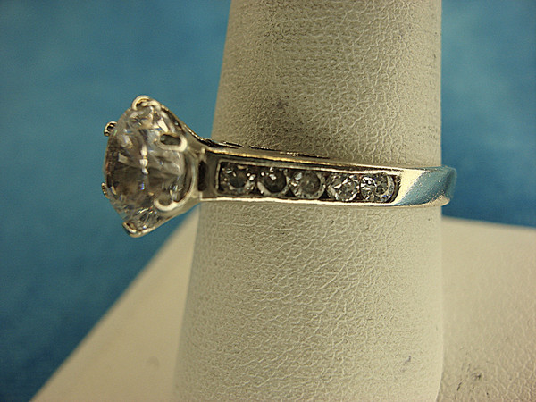 Sterling Silver Filigree Ring with 1 Large Round Sim Diamond & Smaller Accent Stones (Size 9)