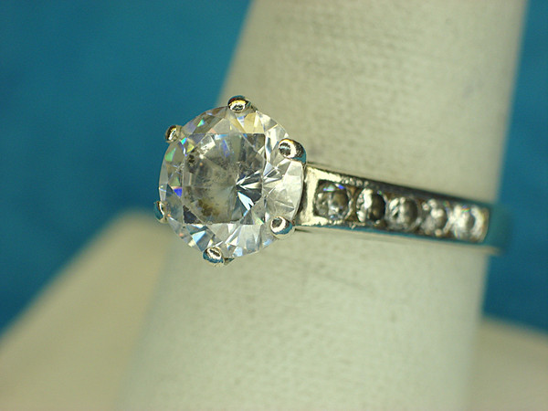 Sterling Silver Filigree Ring with 1 Large Round Sim Diamond & Smaller Accent Stones (Size 9)